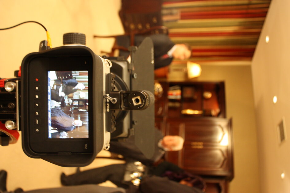 Behind-the-scenes camera monitor during an interview with President Jimmy Carter
