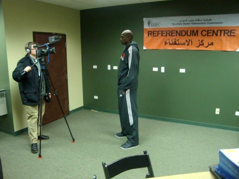 Kane Farabaugh filming an interview at the Southern Sudan Referendum Centre