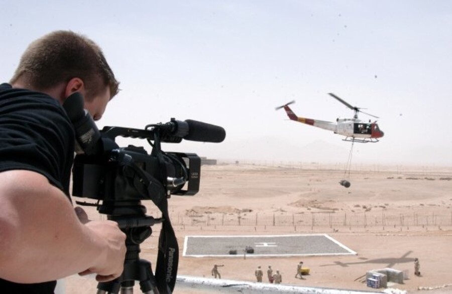 Kane Farabaugh filming a military helicopter landing
