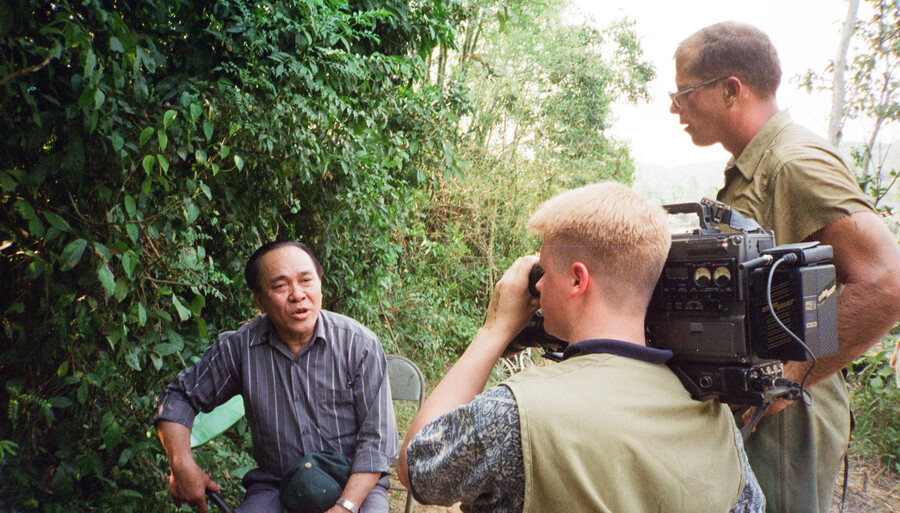 Kane Farabaugh's crew interviewing a man in the field